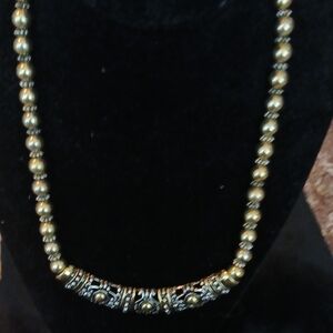 Beautiful gold tone with black and silver Avon necklace